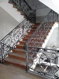 Wrought Iron Stair Railing, Entrance Gate, and False Balcony Railing